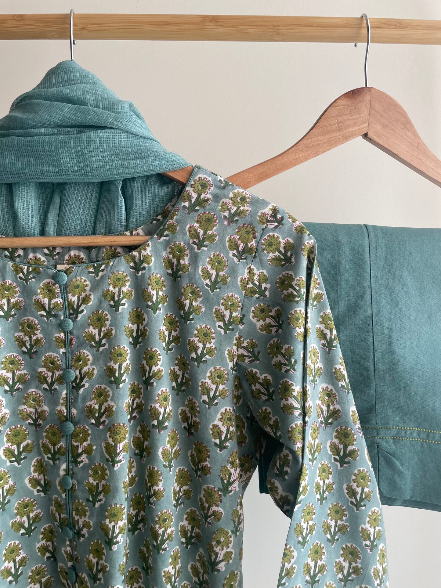Green Floral Print Cotton Suit with Thread Embroidery and Potli Buttons